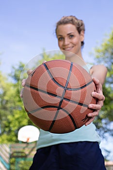 female basketball player holding ball