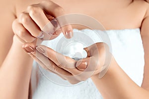 Female beautiful well-groomed hands with shaving foam close-up. Body care, personal hygiene, female beauty