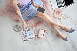 Female beauty blogger with smartphone indoors,