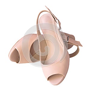Female beige shoes pair isolated.
