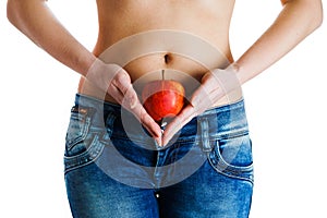 Female belly. Woman Hands holding red apple. IVF, pregnancy, diet concept.