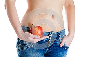 Female belly. Woman Hands holding red apple. IVF, pregnancy, diet concept.