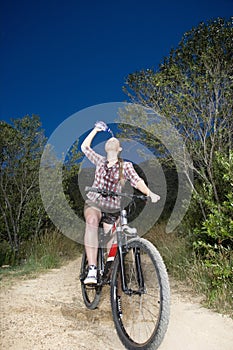 Female Biker Spilling Water Over Face