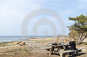 Female bird watcher by a wooden table