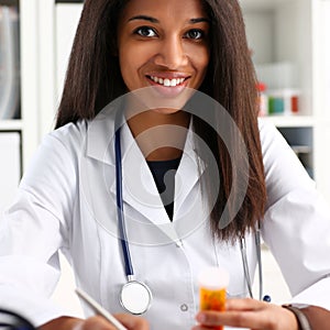 Female black medicine doctor hand hold jar