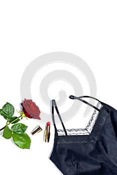 Female black T-shirt jacket with lace, red lipstick and rose flowers on white background top view flat lay. Beauty fashion