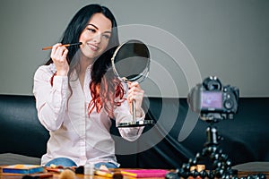 Female bloggblogging, technology, videoblog, makeup and people concept