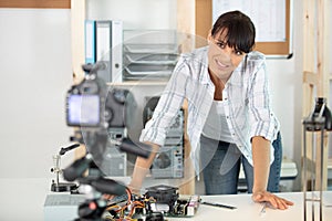 Female blogger recording video at home