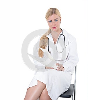 Female blonde doctor posing