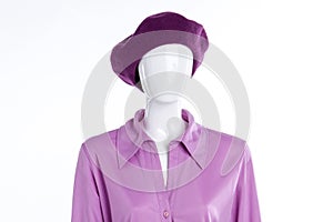 Female blouse and beret on mannequin.