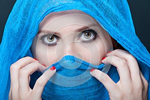 Female with blue burka looking mysterious