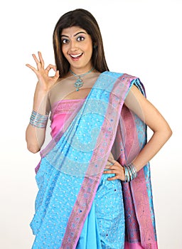 Female with blue sari saying excellent