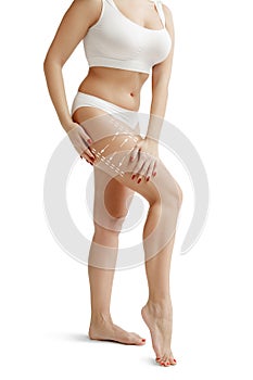 Female body with the drawing arrows. Fat lose, liposuction and cellulite removal concept