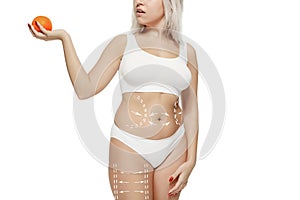 Female body with the drawing arrows. Fat lose, liposuction and cellulite removal concept