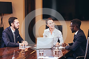 Female boss talking to business team