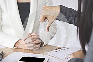 Female boss unhappy and disappointed with the project showing hand dislike to the team