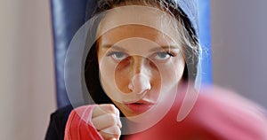 Female boxer practicing boxing in fitness studio 4k