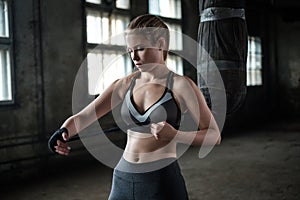 Female Boxer preparing for training in Boxing Club