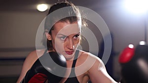 Female boxer in sparring. Amateur boxing. Self-defense