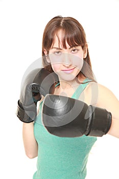 Female boxer throws a left hook