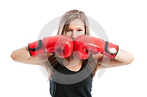 Female boxer touching red boxing gloves