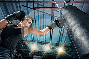 The female boxer training at gym
