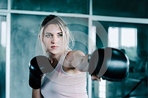 Female Boxer is Training Punch Boxing in Fitness Gym, Portrait of Sport Boxer Woman in Sportswear Exercised Practicing Boxing in