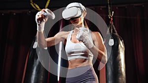 Female boxer training with VR or virtual reality. Impetus