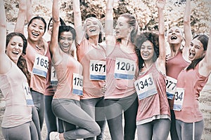 Female breast cancer marathon runners cheering