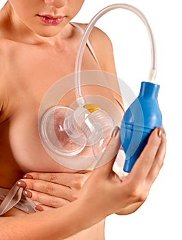 Female breast feeding with breastpump