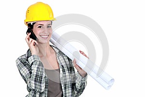 Female builder with plans