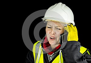 Female builder shouting on phone