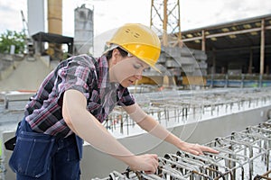 Female builder working outdoors on site