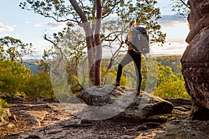 Female bushwalker with backpack walking in Australian bushland