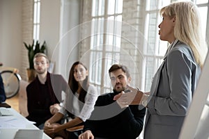 Female business leader giving workshop to employees