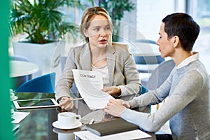 Female Business Partners Discussing Contract