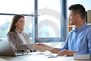 Female business trainer coaching young man