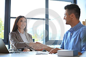 Female business trainer coaching young man