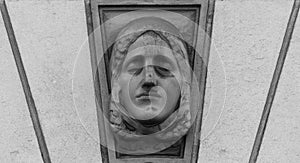 Female bust framed on the wall