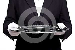 Female butler holding a silver tray isolated