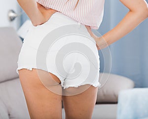 Female buttocks in denim shorts