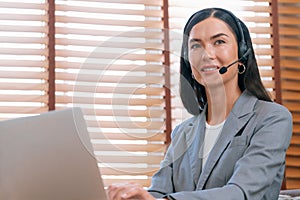 Female call center operator or customer service helpdesk staff. Blithe