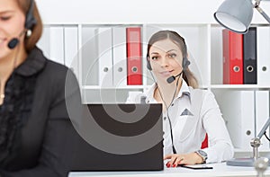 Female call center service operator at work.