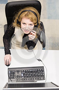 Female call centre operator doing her job top view