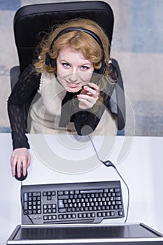 Female call centre operator doing her job top view