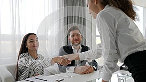 Female candidate on meeting with secretary and boss in boardroom, woman in modern office on interview, handshake