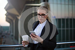 Female candidate using messenger on cellphone