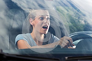female car driver in panic