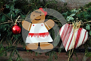 Female cardboard gingerbread man and christmas decorations