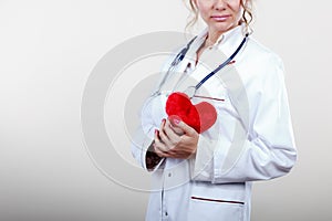 Female cardiologist with red heart.